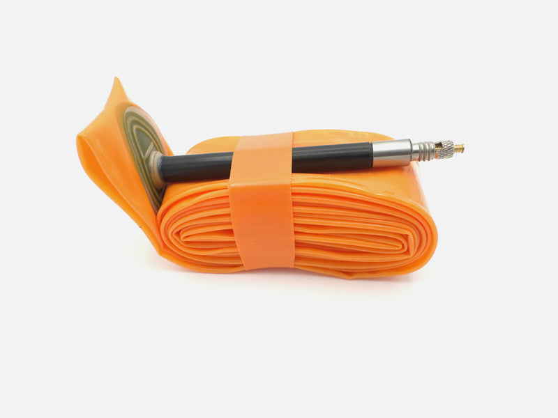 Litebike TPU inner tubes, displaying the compact, lightweight tube, meticulously engineered with nanotechnology for strength, speed, and portability, ideal for road cycling and bikepacking.