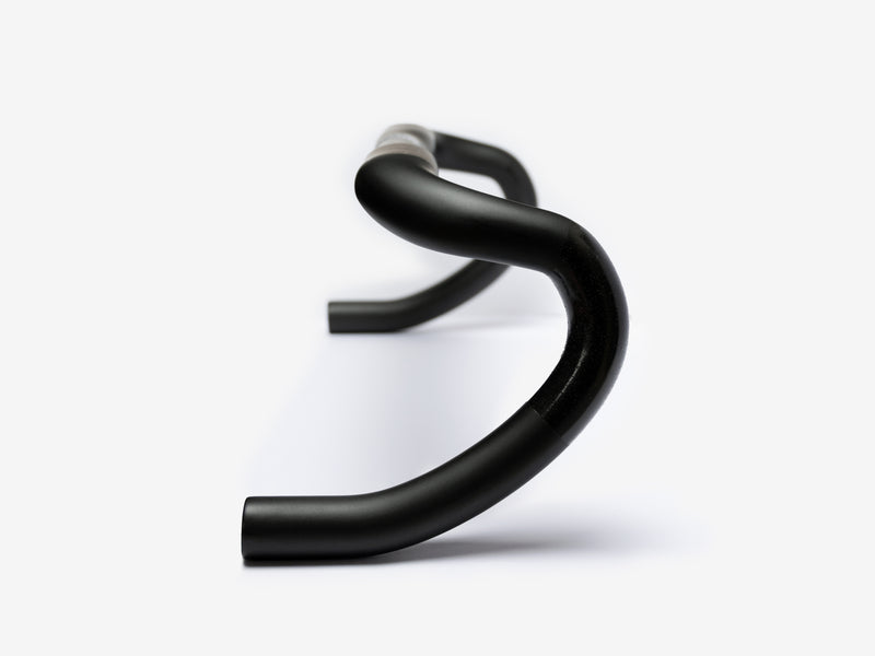 Litebike x Pro lightweight carbon handlebars, Featuring external routing details, ergonomic grip, and tightly woven carbon finish, designed to enhance performance and reduce fatigue during rides.